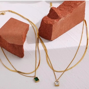 Double layered 18K gold plated snake chain necklace with square green and white gemstones
