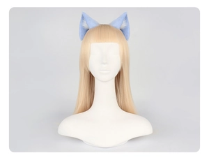Close-up of light blue cat ear hair clips with soft faux fur on a blonde wig mannequin