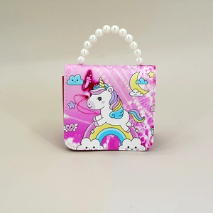 Detailed view of pink kid purse featuring unicorn print and a white pearl handle
