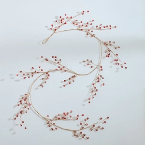 Festive red Christmas berry garland with shimmering gold glitter branches for DIY holiday decor