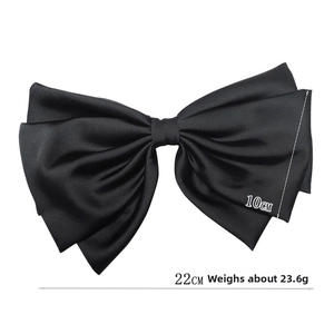 Detail view of a large black satin bow hair clip measuring 22cm by 10cm and weighing 23.6g