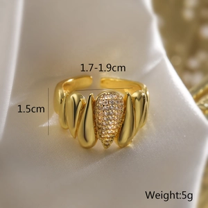 Macro shot of 18K gold plated wide ring with teardrop texture and zircon inlay