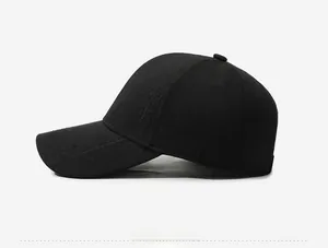 Detail of a black cotton baseball cap showing side profile and gold metal badge logo