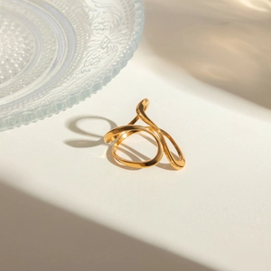 Detail shot of vintage 18k gold plated stainless steel ring with curved hollow lines