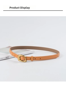 Detailed view of an orange-brown slim leather belt with an irregular matte gold buckle