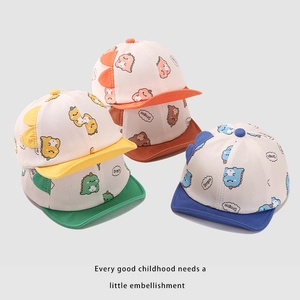 Close-up of soft cotton baby baseball caps featuring colorful cartoon dinosaur prints