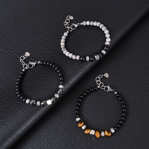 Three beaded bracelets with tiger eye, onyx stones and lobster clasp on black leather