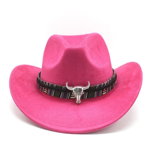 Detail of fuchsia suede cowboy hat featuring ethnic braided band and silver bull head ornament