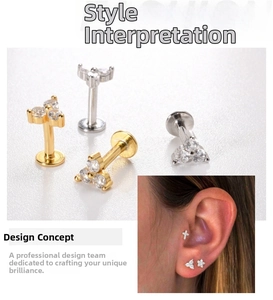 Detail of G23 titanium labret studs featuring three zircon stones in a floral cluster