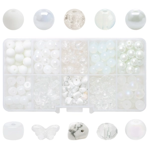 Detailed view of white crystal glass beads with crackle and matte textures in a storage box