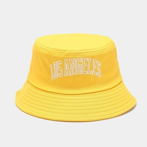 Detail of Los Angeles embroidery and reinforced stitching on yellow cotton bucket hat