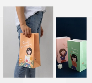 Detailed view of colorful cartoon gift bags with teacher appreciation slogans and handles
