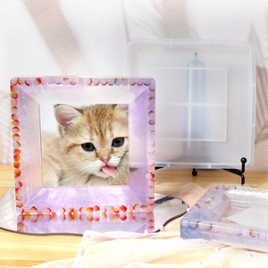 Detail of DIY epoxy resin photo frame mold with a finished purple glitter resin kitty frame