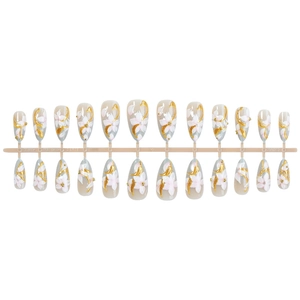 Almond shaped press-on nails with 3D white flower petals and gold bead accents