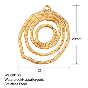 Detailed view of golden stainless steel irregular ring pendant with hammered texture