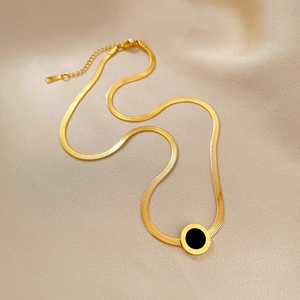 Gold-plated titanium steel Roman numeral necklace with black disc pendant on silk
