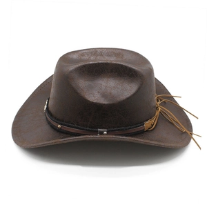 Detail of dark brown western cowboy hat featuring leather texture and rivet band