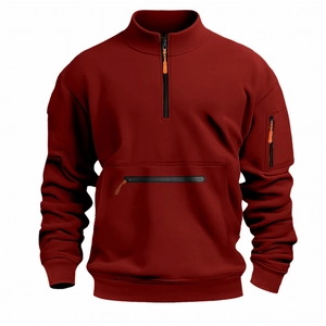 Detail of dark red quarter-zip sweatshirt with stand collar and multiple zip pockets