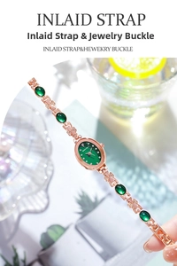 Detail of rose gold watch band featuring green emerald stones and butterfly motifs