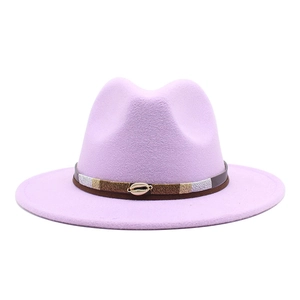 Close-up of lavender wool fedora with dark brown band and a gold shell accessory