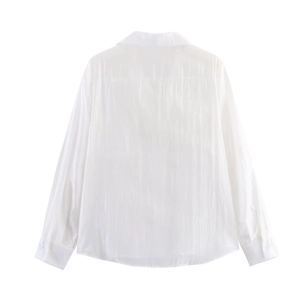 Rear view detail of a white casual long sleeve shirt featuring a textured cotton fabric