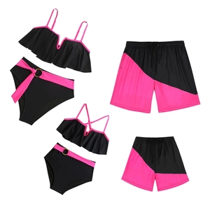 Matching family swimwear set with black ruffles and neon pink accents in 4-piece layout