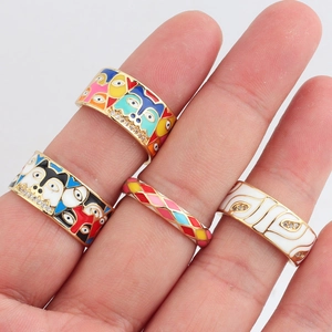 Set of four geometric colorful enamel drip oil rings with gold plating for women
