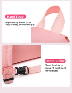 Detailed view of the ergonomic pink backpack handle and adjustable chest buckle strap