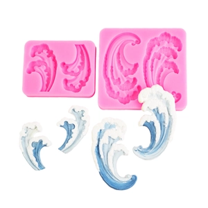 Pink silicone wave molds with blue and white fondant wave decorations for cake topping