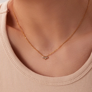 Retro 18k gold plated titanium necklace with marquise-cut zircon pendant on model