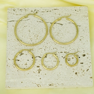 Set of five various sizes 18K gold-plated stainless steel hoop earrings on stone
