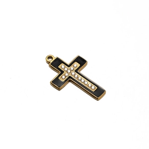 Detail of cross pendant with gold metal edges, black enamel finish and white rhinestones