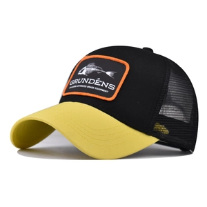 Close-up of mesh back and fishbone patch on yellow and black trucker baseball cap