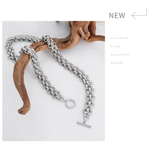 Detail of silver multi-layer chunky chain necklace with stylish OT toggle clasp
