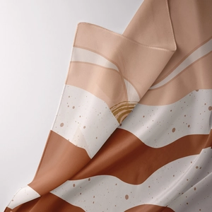 Close-up of bohemian tapestry fabric with abstract waves and fine hem stitching details