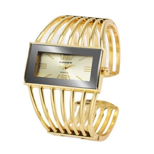 Golden CANSNOW bangle watch for women featuring a rectangular dial and hollow metal strap