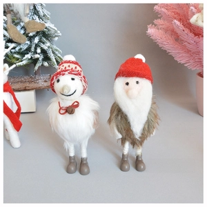 Detailed view of handmade wool felt snowman and Santa figurines for Christmas tree decor