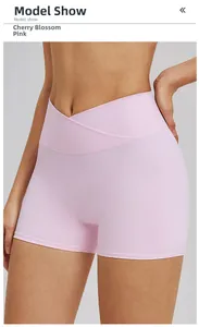 Detail of high-waisted yoga shorts in cherry blossom pink with V-shaped crossover waistband