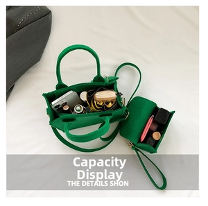 Detail view of large capacity green felt tote bag showing inner storage compartments