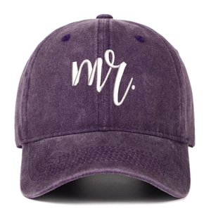 Detail of white embroidered 'mr.' script on vintage washed purple cotton baseball cap