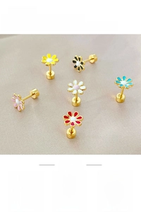 Detail of colorful enamel flower stud earrings in gold-tone setting for women