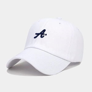 Close-up of white cotton baseball cap featuring detailed navy blue letter A embroidery