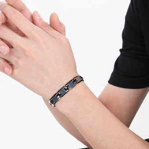 Minimalist black H-shaped adjustable tungsten steel bracelet on a model wrist