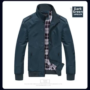 Detail of dark green men's jacket showing ribbed stand collar and plaid lining fabric