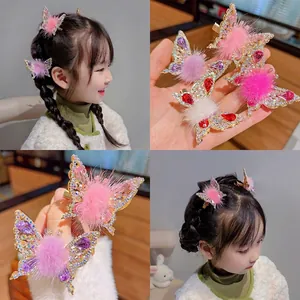 Sparkling butterfly hair clips for girls with colorful rhinestones and soft fur pom-poms