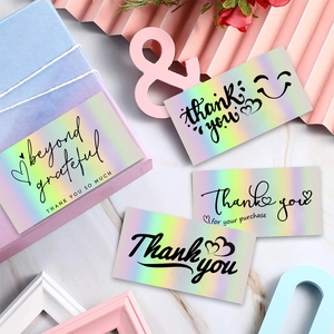 Holographic laser rainbow thank you cards on marble background with floral decor