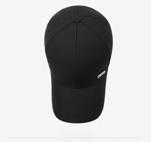 Top view of a black cotton baseball cap with a silver metal 'Fashion' plate on the side