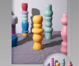 Macro shot of stacking geometric silicone candle molds in pastel Morandi colors