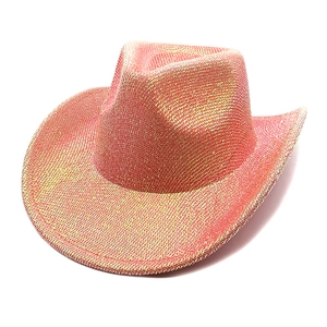 Detail of pink cowboy hat with golden glitter finish and shimmering woven texture