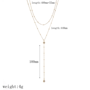 Schéma technique montrant les dimensions du collier Y doré 18k et du pompon